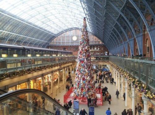 a large christmas tree in a train station at Private Double Bedroom in King's Cross St Pancras in London