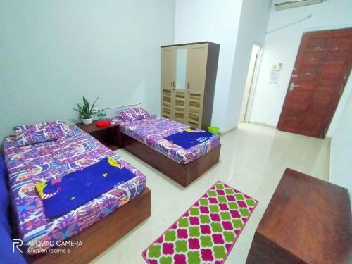 Katil atau katil-katil dalam bilik di WismaALAS Syariah Guesthouse