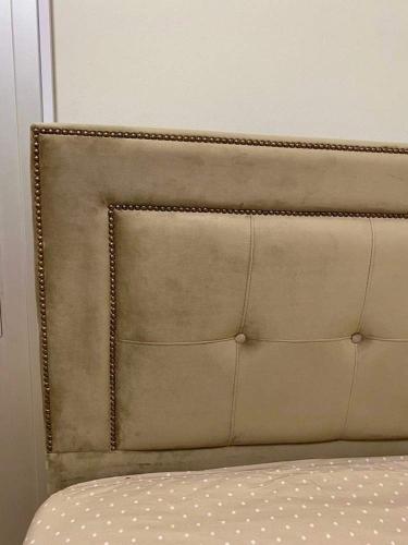 a headboard of a bed in a room at INCREDIBLE VIEW in Larnaka