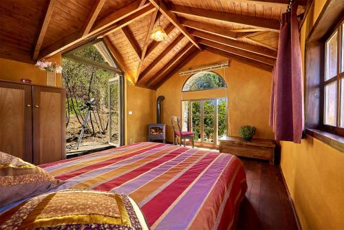 Postel nebo postele na pokoji v ubytování Romantik Finca El Rincon
