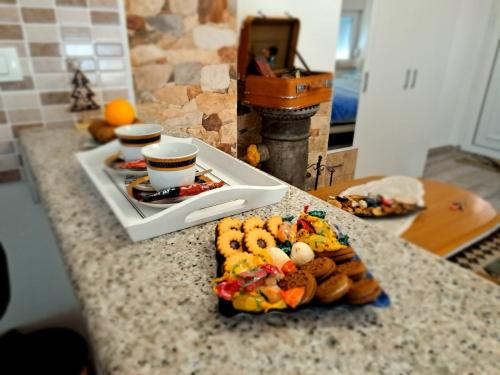 a table with a plate of food on a counter at Studio Apartments KIM - Dilberovic in Mostar