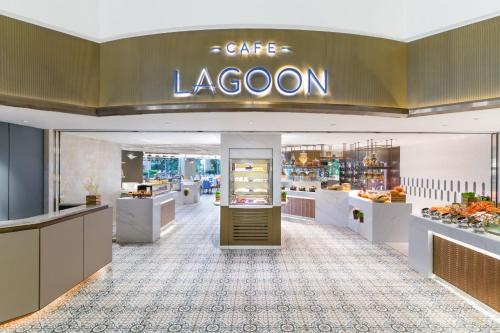 a store with a cafe lagoons sign on the wall at Hong Kong Gold Coast Hotel in Hong Kong
