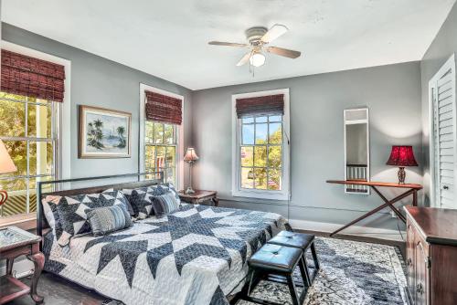 a bedroom with a bed and a ceiling fan at The Landmark St Augustine in Saint Augustine