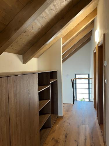 a room with wooden ceilings and wooden shelves at VILLA BOHEMIA - Boží Dar in Boží Dar