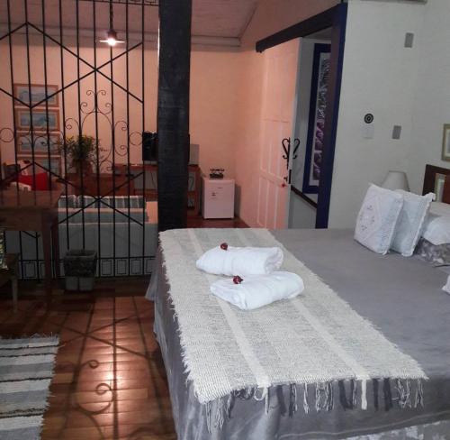 מיטה או מיטות בחדר ב-Pousada Flor de Íris