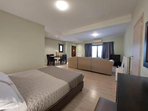 Ένα ή περισσότερα κρεβάτια σε δωμάτιο στο Perivoli Country Hotel & Retreat