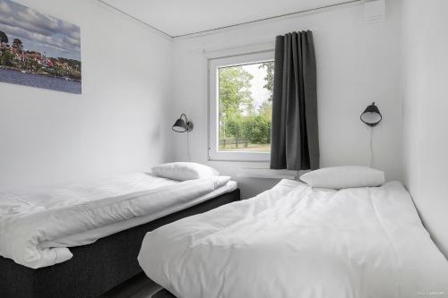 Postel nebo postele na pokoji v ubytování First Camp Skönstavik Karlskrona