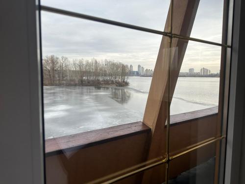 a view from a window of a frozen lake at Отель Фараон in Kyiv