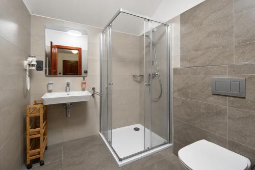 a bathroom with a shower and a sink at Chalupy Na Rališce in Horní Bečva