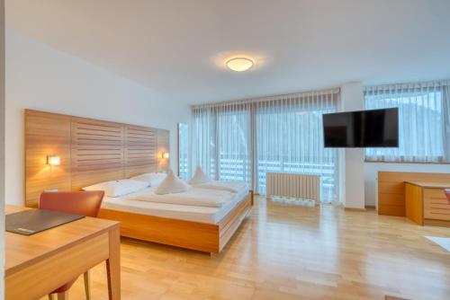 Postel nebo postele na pokoji v ubytování Hotel Cevedale