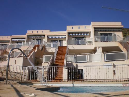 a building with a playground in front of it at Villas Montemar in San José