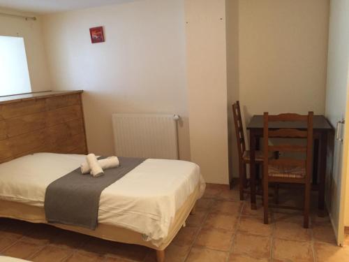 Cama o camas de una habitación en Auberge Les Fontilles