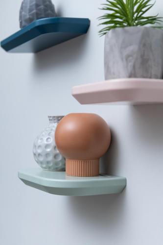 a toy on a shelf with a golf ball at Enattica Syntagma Living in Athens