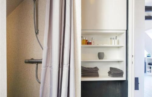 a shower with a shower curtain in a bathroom at Awesome Apartment In Rønne With 1 Bedroom And Wifi in Rønne