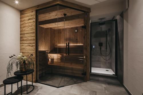 a shower with a glass door in a bathroom at VAYA Seefeld in Seefeld in Tirol