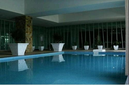 Swimming pool sa o malapit sa Risqi Apartment 3 bedroom Wakaf Che Yeh