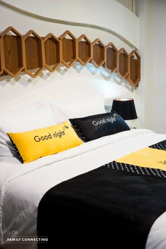 Ένα ή περισσότερα κρεβάτια σε δωμάτιο στο The Hive Chiang Mai Hotel