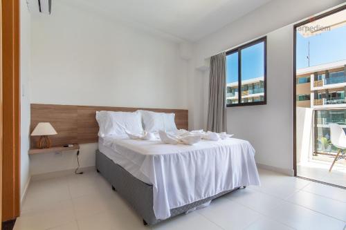 Cama ou camas em um quarto em Mana Beach #C112 - Para 3 Pessoas por Carpediem