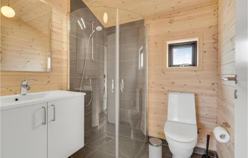 a bathroom with a shower and a toilet and a sink at An Awesome Home In Storvorde With 4 Bedrooms And Wifi in Storvorde