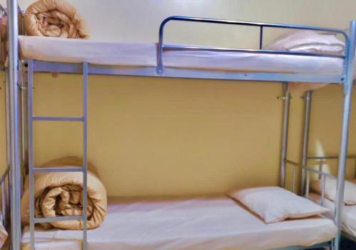 a bunk bed with two bunk beds in a room at Welcom Tourist Hostel in Dubai