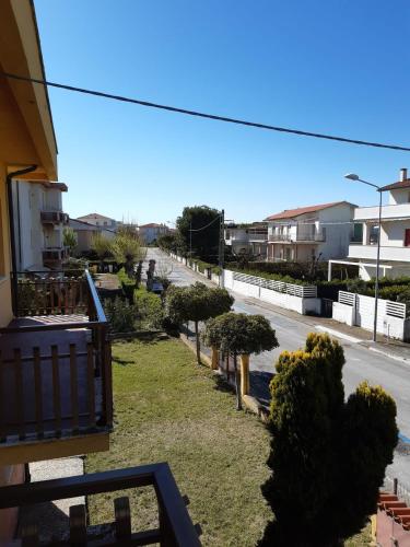a view from a balcony of a street with trees at La casa al mare in Marcelli