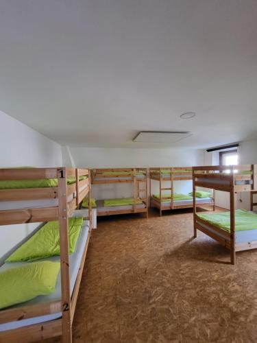 a group of bunk beds in a dorm room at Bus Station Beds in Bled