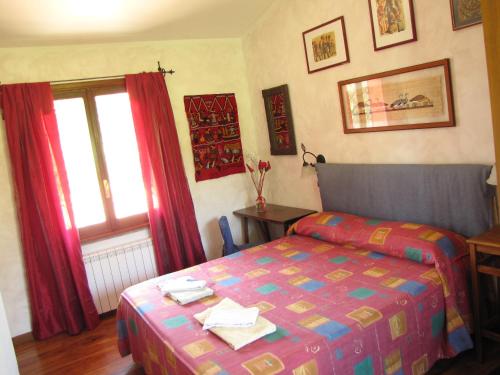 a hotel room with a bed and a window at B&B Ai Glicini - Castelli Romani in Marino