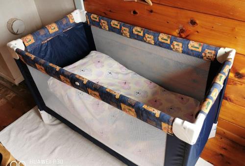 a small bed with a blue and white bed frame at Alone In The Woods With Your Own River Nearby in Fitjar