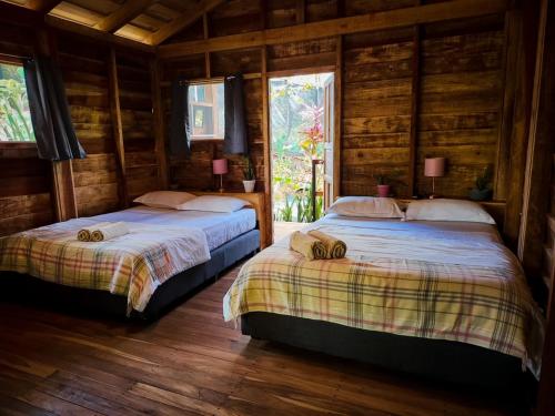 Postel nebo postele na pokoji v ubytování Glamping Hotel Flor y Bambu