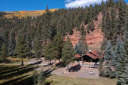 an aerial view of a lodge in the mountains with trees at Slippery Rock River Ranch in Dolores