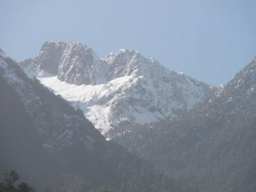 a mountain with snow on top of it at Cabaña Arriendo Llifen in Futrono