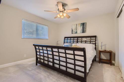 a bedroom with a bed and a ceiling fan at 7213 S Tamarac St in Centennial