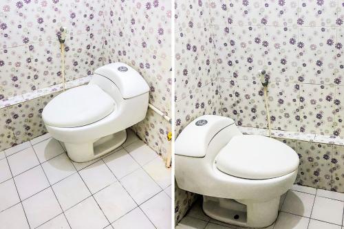 a bathroom with a toilet and a bidet at OYO 92060 We Bro Kost in Kupang