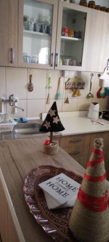 a kitchen with a table with a christmas tree on it at My Home Tara in Mitrovac