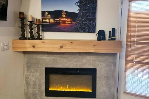 a fireplace with a tv on top of it at Skiers Dream Upscale Condo By Teton Village! in Wilson