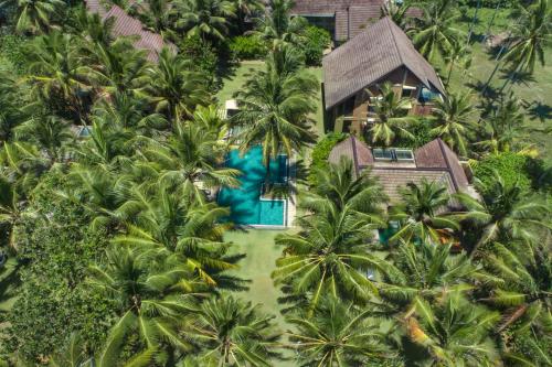 an aerial view of a resort with a pool and palm trees at Ayana Sea in Wadduwa
