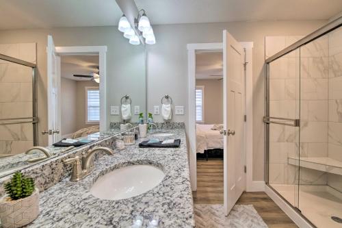 a bathroom with a sink and a shower at Pet-Friendly Ozark Home with Yard and Patio in Ozark