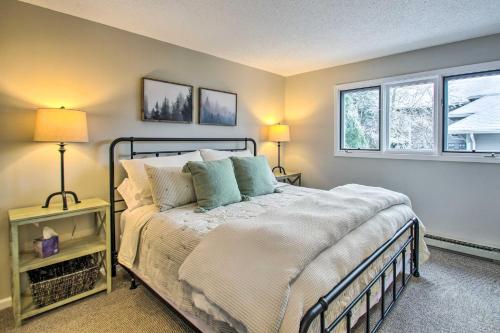 a bedroom with a bed and two windows at Wintergreen Resort Condo Walk to Ski Lift! in Mount Torry Furnace