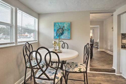 a dining room with a table and chairs at Pet-Friendly Gulfport Home Less Than 2 Mi to Beach in St Petersburg