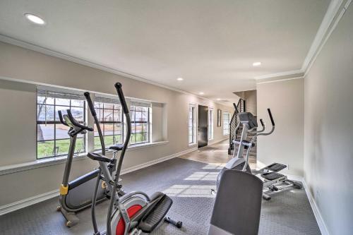 a gym with three exercise bikes in a room at Immaculate Woodland View Retreat with Hot Tub in Tulsa