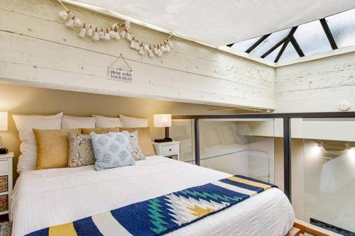 a bedroom with a bed in a room at The Owl's Nest @ Manitou: Mtn Views on Main Street in Manitou Springs