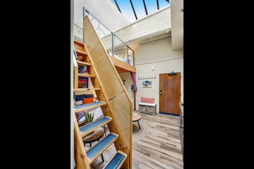 a room with a surfboard sitting on a shelf at The Owl's Nest @ Manitou: Mtn Views on Main Street in Manitou Springs