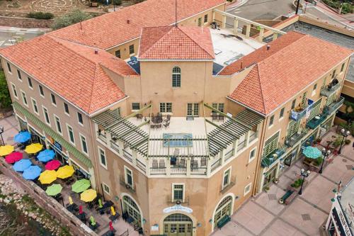 an overhead view of a building with umbrellas at The Owl's Nest @ Manitou: Mtn Views on Main Street in Manitou Springs