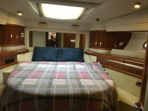 a bed in the back of a boat at yatch for rent izmir cesme 3 camaras kiralik yat in Ildır