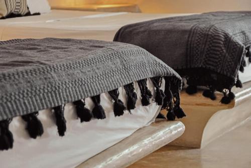 a close up of a blanket on a table at Boutique Hotel Posada 06 Tulum in Tulum