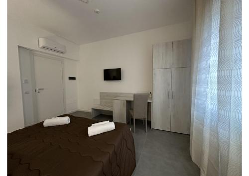 Ένα ή περισσότερα κρεβάτια σε δωμάτιο στο GIROOMS B&B