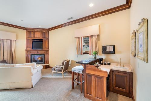a living room with a couch and a table at Stock Farm Inn in Hopland