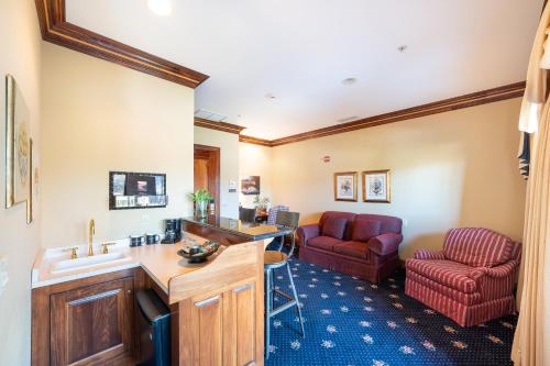 a room with a sink and a living room at Stock Farm Inn in Hopland