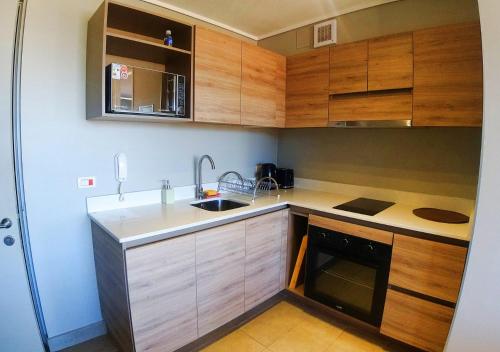 Apart Hotel Bauerle & Apartamentosにあるキッチンまたは簡易キッチン