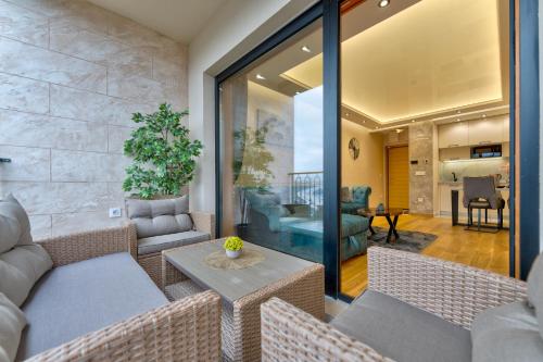 a living room with couches and a table at Apartman Lux M&B 2 in Zlatibor